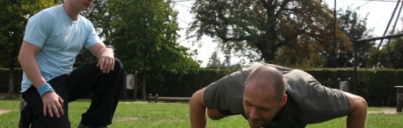 Timed exercise, performing push-ups in the park