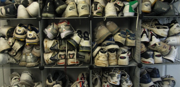Dozens of pairs of sneakers, crammed into gym lockers