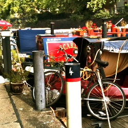 Bike on Regent's Canal, parked beside canal boats