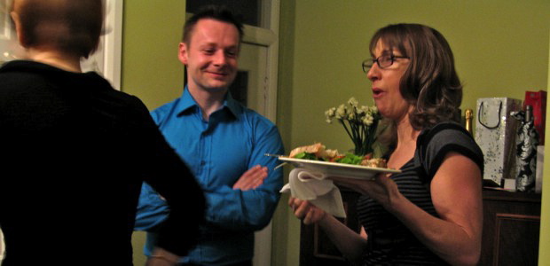 Group of people making small talk at a party