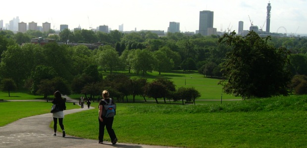 Female commuter carrying a portable gym in a rucksack, on Primrose Hill