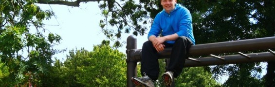London Personal Trainer seated on top of monkey bars